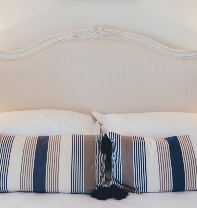 A Hamptons style bed headboard